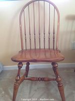 Front view of Hitchcock Aldrick Side Chair showing rounded spindle backrest and turned legs.