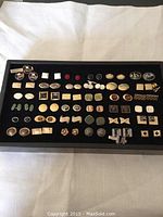 Tray of 36 pairs assorted cufflinks on black velvet