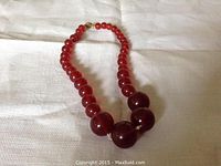 Necklace laid out showing overall length and graduated bead sizes