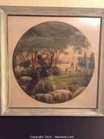 Frontal image of framed circular aquatint etching featuring a shepherd, sheep, and deer in a natural forest setting.