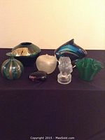 Full lot view with all six art glass pieces arranged on a dark surface.