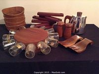 Overall view of the teak items including spice wheel with glass jars, shakers, salad forks, bowls and teapot