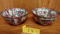 Two bowls showing hand-painted Rose Famille medallion pattern