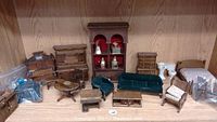Overview of doll house furniture set including sofa, chairs, tables, cabinets, and small bathroom toilet.