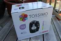 Photo of Bosch Tassimo T65 coffee maker box with brand and model visible.
