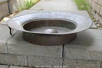 Side view showing shallow basin and rolled rim