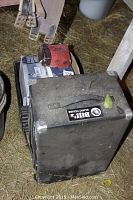 Single view of Bill's Music House speaker with some dust and a leaf on top, showing the overall condition of the speaker with protective metal corners.