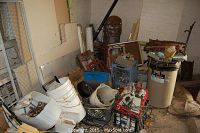 Overview of floor pile with plastic buckets, crates and assorted scrap metal