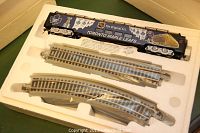 Image showing boxed Toronto Maple Leafs train car and three curved track sections in protective styrofoam packaging.