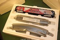 Full view of the Montreal Canadiens train car and included track pieces inside original white foam packaging.