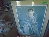 Full view of framed print showing gyrfalcon on cliff, double mat and frame