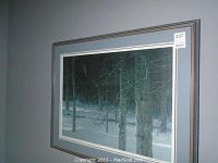 Framed Robert Bateman limited edition print showing snowy forest scene with trees