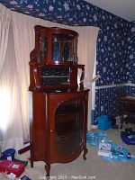 Full front view of china cabinet showing upper hutch, lower cabinet and overall design