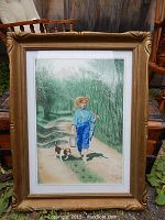 Full framed watercolor painting showing the boy, dog, and fishing gear, broad view including the gold ornate frame.
