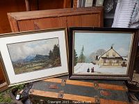 Both framed artworks shown together on trunk