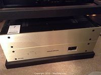 Front view of silver-faced amplifier showing power switch and LED indicators