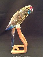 Front-side view of Swarovski crystal Green Rosella parrot on stand