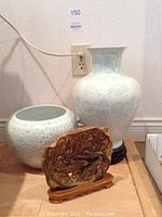 Lot overview showing both porcelain vases and stone display