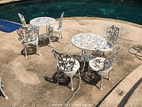 Overview of two outdoor furniture sets arranged by pool