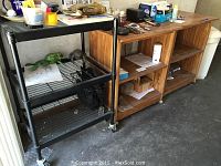 Photo showing all three shelf units side by side: two wooden shelving units and one metal unit with wheels.