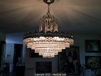 Full view of chandelier illuminated
