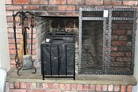 Full view of fireplace setup showing metal screen, wood holder with Dura Flame logs, and fireplace tools on stand