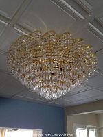 Wide view of chandelier mounted on ceiling, showing full size and shape