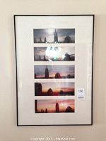 Framed set of five New York City skyline prints showing skyscrapers such as Empire State Building during sunset in black frame with white matting.