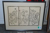 Frontal view of the framed black and white print featuring three abstract figure panels.