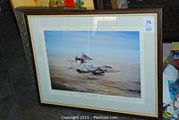 Framed artwork showing RAF Jaguar jets flying over a desert, titled 'Desert Cats'.