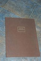 Brown cloth folio cover titled “Instant Variations”