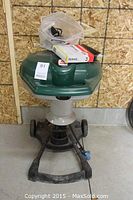 Front view of mosquito trap on wheeled base