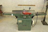 Front view of jointer showing infeed/outfeed tables and fence