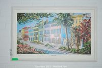 Full view of the framed colorful print depicting Rainbow Row in Charleston with palm trees and flowers.