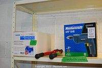 Mastercraft 3/8" drill in box, 7" woodworking vise in box, and 18" bolt cutters on shelf