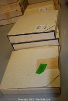 Four labeled protective boxes containing the plates, each marked with month names Janvier, Avril, and Aout.