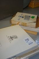 Stacked boxes likely containing the plates showing River Shore Ltd logo on box.