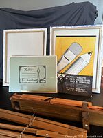 Canvases, sketch pad and wooden canvas carrier