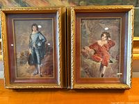 Both framed prints side by side