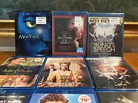Front view showing Avatar, Phantom of the Opera, The King’s Speech, Julie & Julia, The Duchess, Hitman
