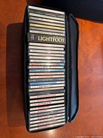 CD collection in zippered case showing spine labels