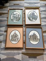 All four framed architectural prints displayed together