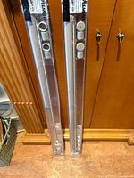 Two sealed IKEA Komplement LED strip lights standing side by side in original retail sleeves