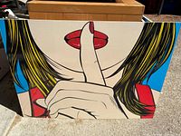 Woman with finger to lips canvas