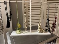 All items hanging on white Ikea T-bar stand