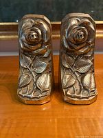 Front view of both metal rose bookends