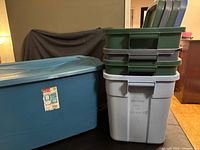 Large blue 109.8 L tote and stack of four smaller totes with lids