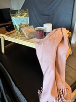 Overall view of lap tray with bath salts, candles, pashmina