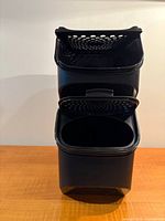 Front view showing both stacked containers, flip lids open