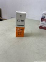Photo of the front side of the product box showing 'Bye Bye Dullness' serum with 15% Vitamin C